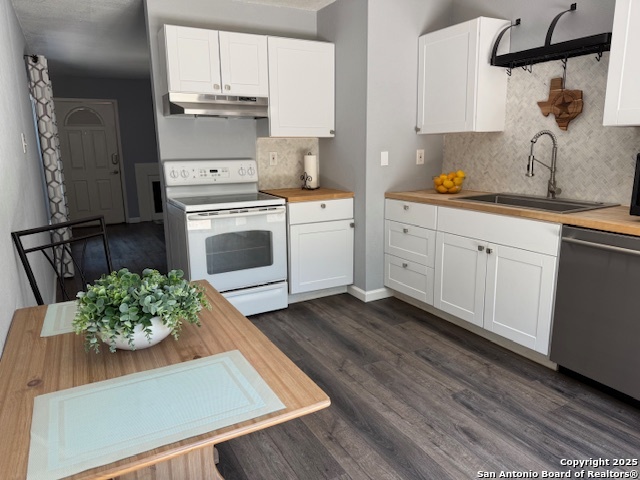 a kitchen with cabinets and window