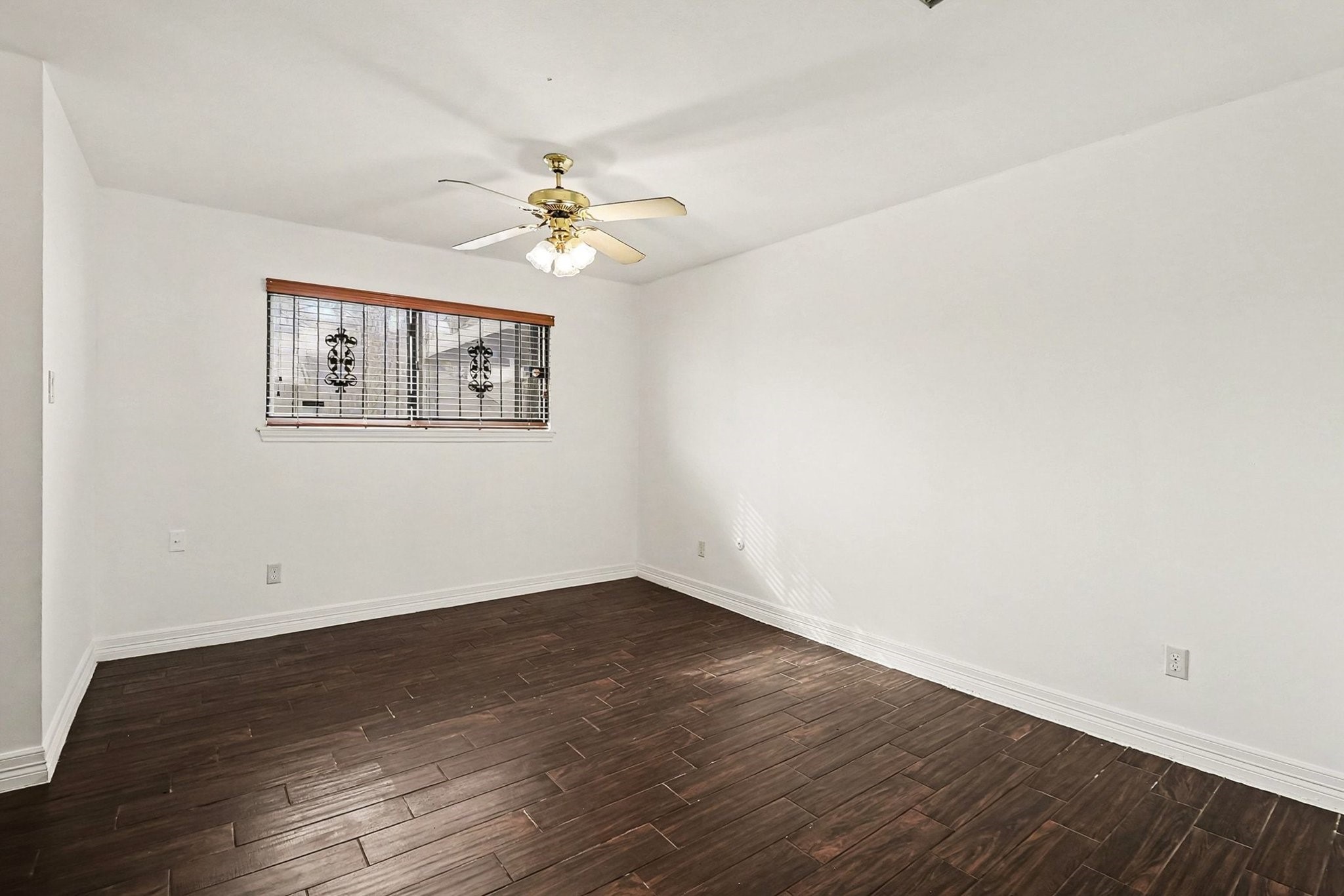 8138 Constellation Lane Houston, TX 77075 - Photo 12 of 16 a view of an empty room with wooden floor