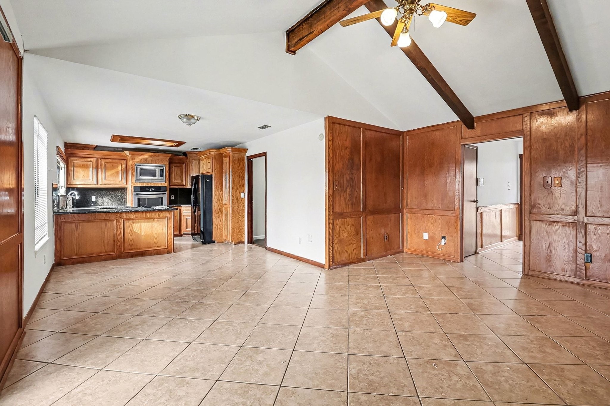 8138 Constellation Lane Houston, TX 77075 - Photo 4 of 16 a view of a kitchen with a refrigerator and a sink