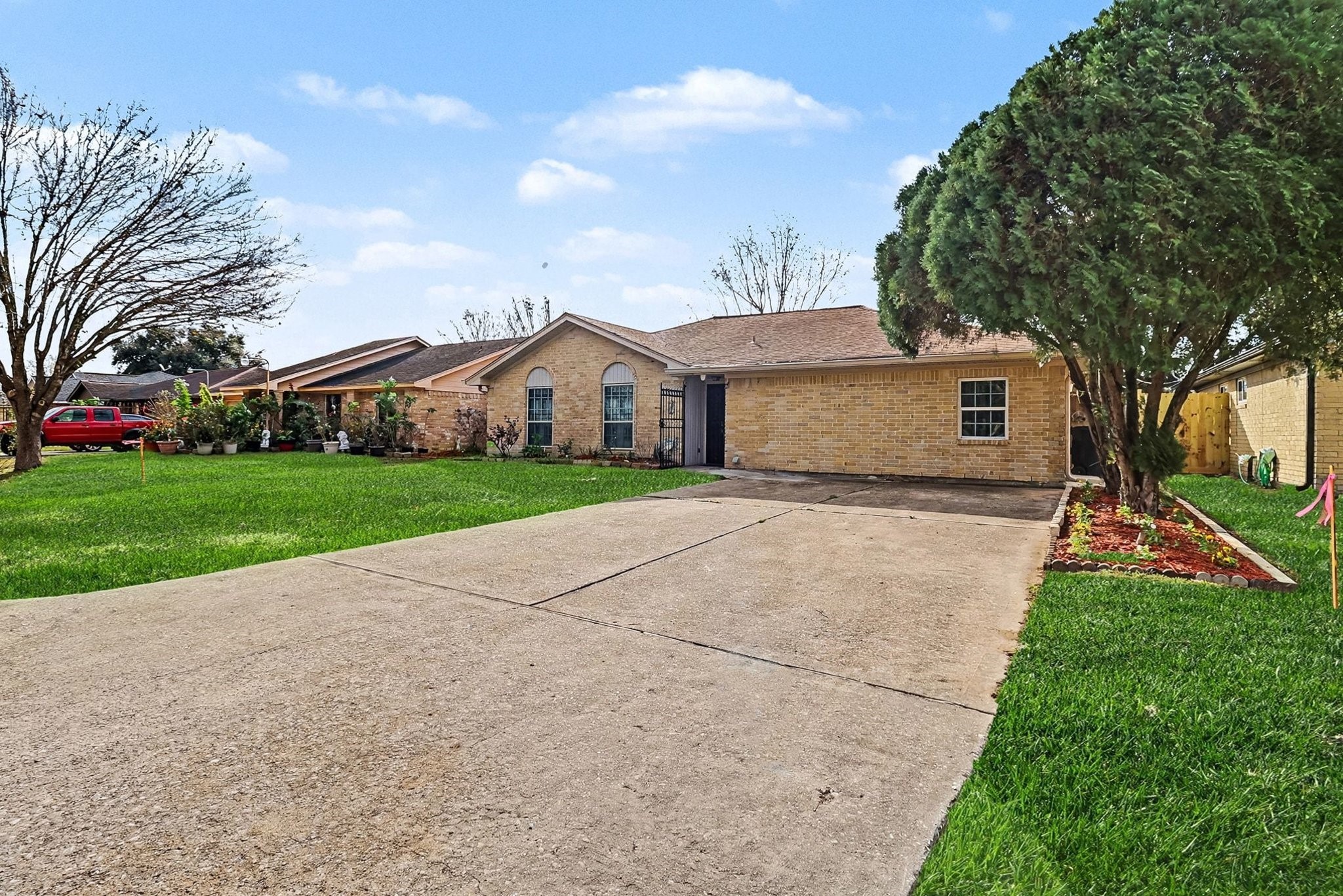 8138 Constellation Lane Houston, TX 77075 - Photo 5 of 16 a front view of house with yard and green space