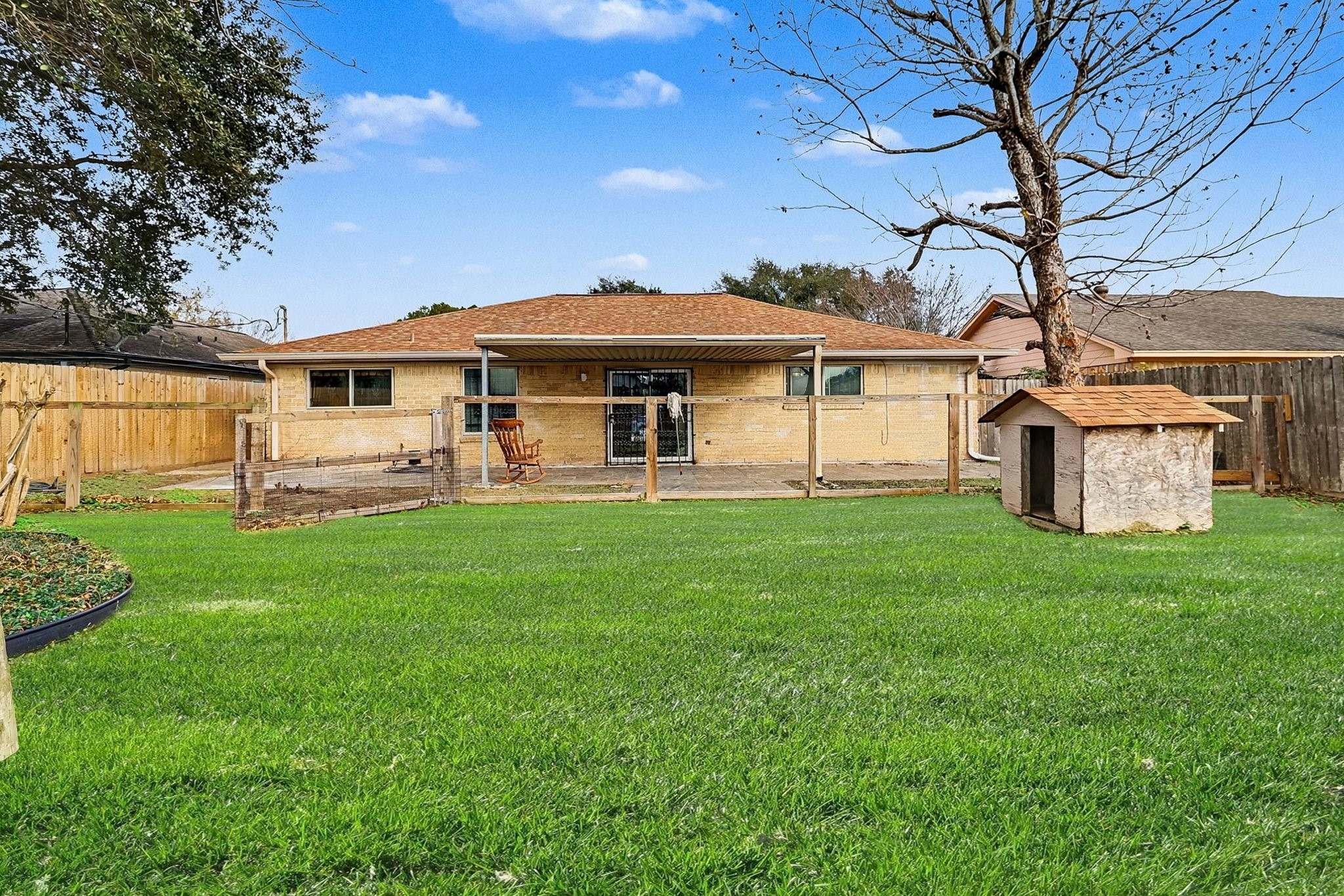 8138 Constellation Lane Houston, TX 77075 - Photo 8 of 16 a front view of a house with a yard porch and wooden fence
