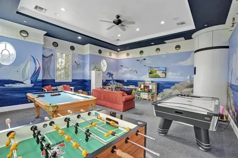 a view of a house with pool and lake view