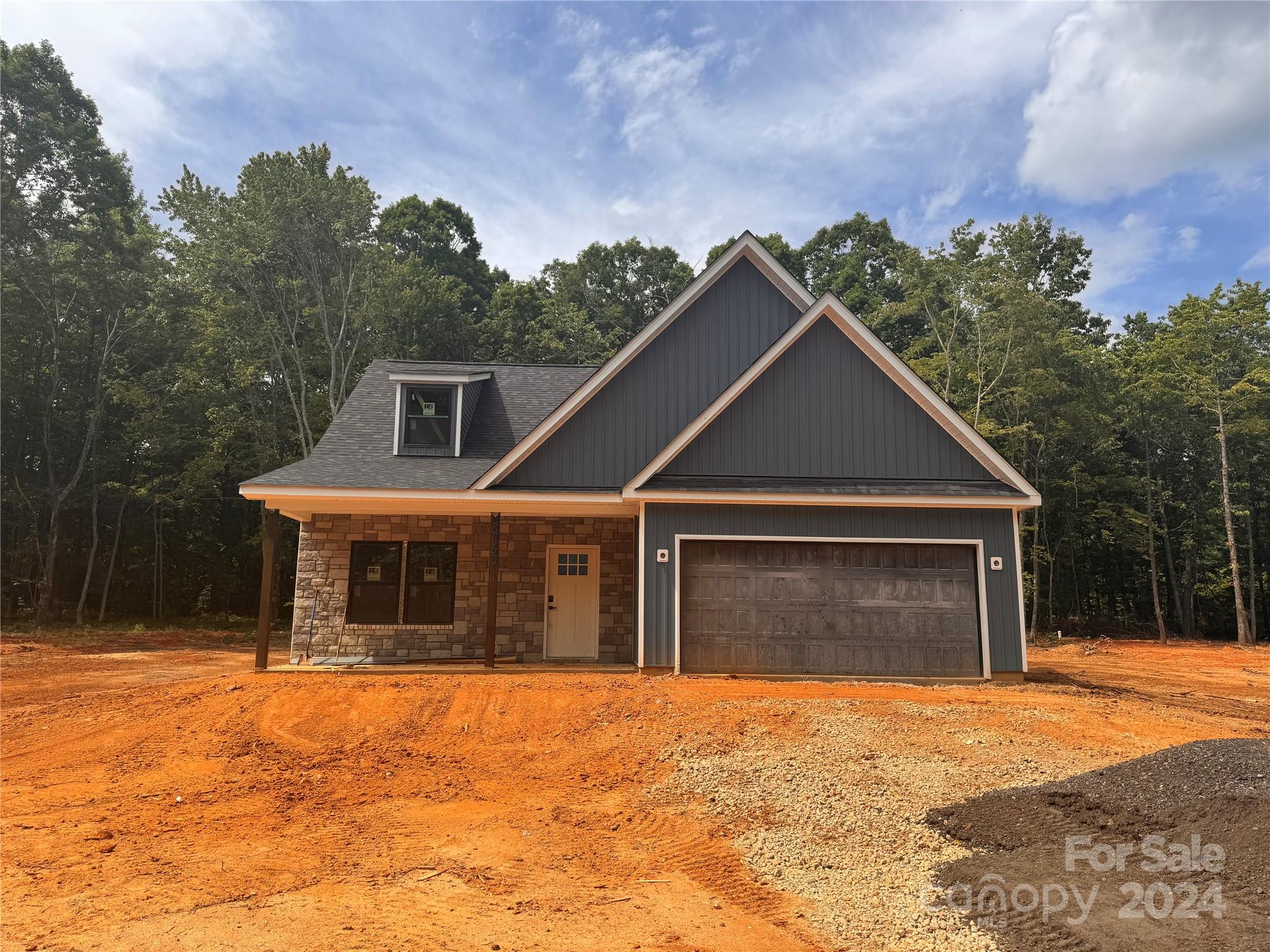 8560 Castor Road Salisbury, NC 28146 - Photo 1 of 13 a front view of a house with a yard and garage