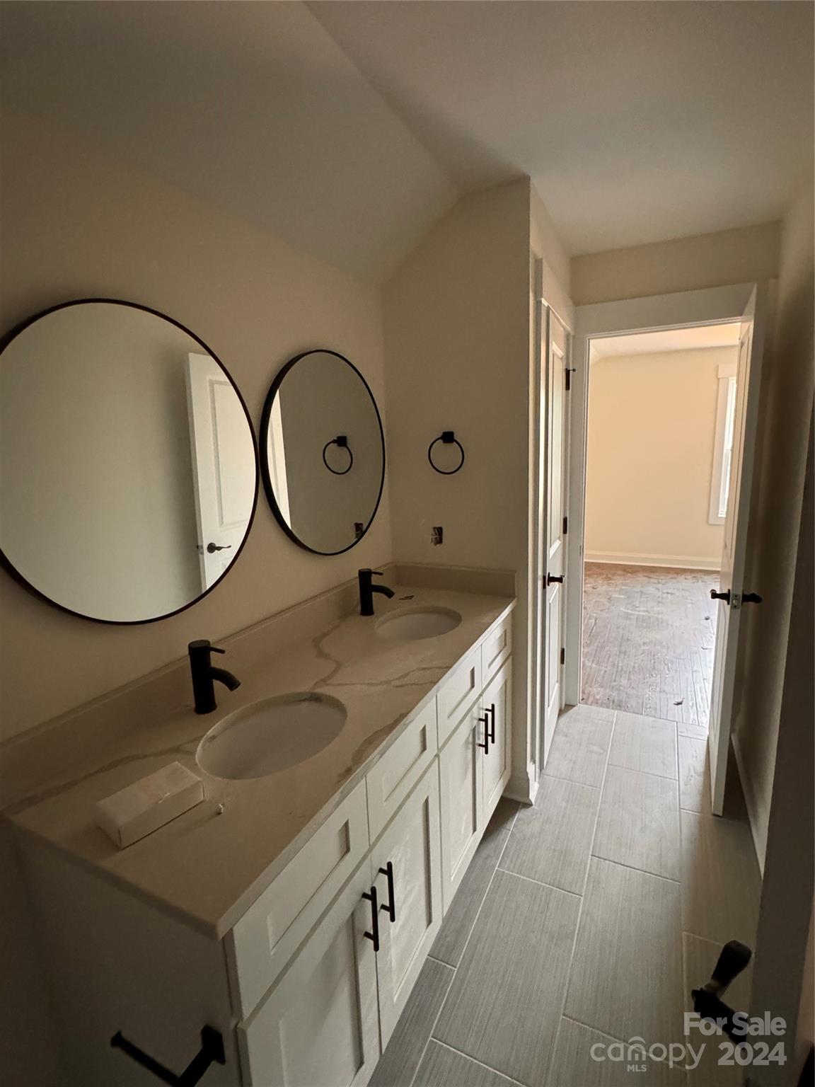 8560 Castor Road Salisbury, NC 28146 - Photo 12 of 13 a bathroom with 2 sink and a mirror