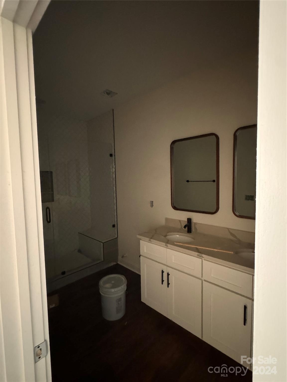 8560 Castor Road Salisbury, NC 28146 - Photo 10 of 13 a bathroom with a granite countertop toilet sink and mirror