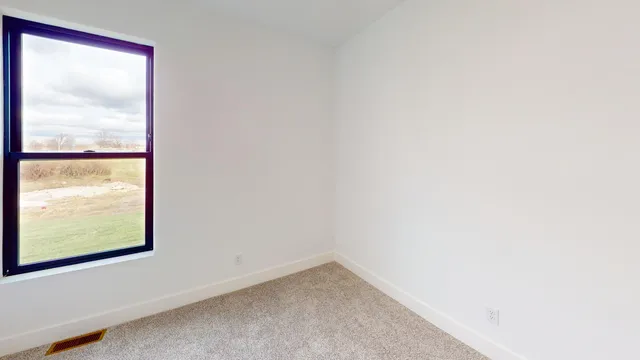 a table and chairs in a dining room with a table