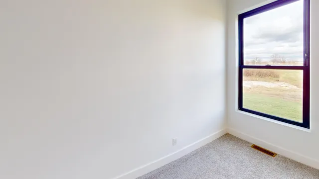 a living room with furniture and window