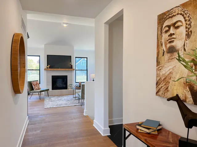 a kitchen with a sink refrigerator and cabinets