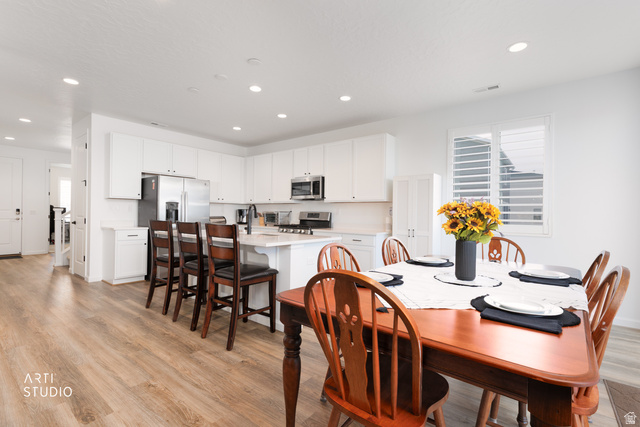 540 Lefty Lane Tooele, UT 84074 - Photo 8 of 48 Dining space featuring light wood-style floors and recessed lighting