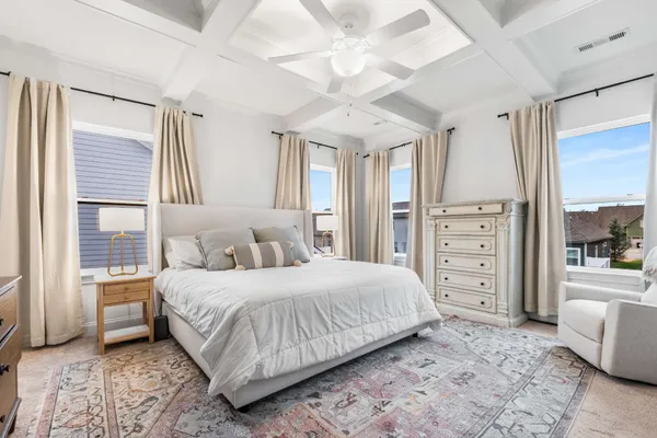 a bedroom with a large bed and a closet