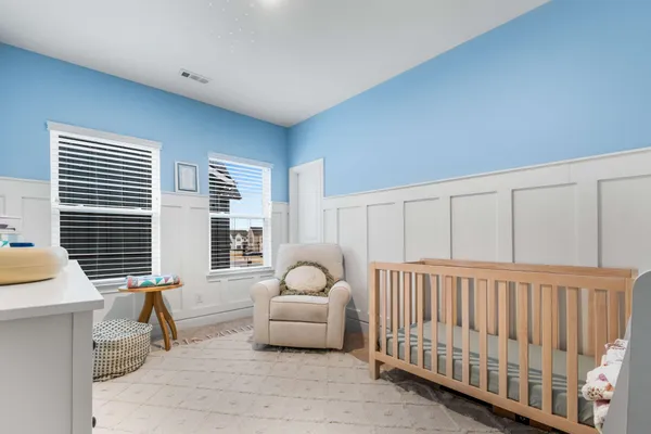 a bedroom with furniture and a window