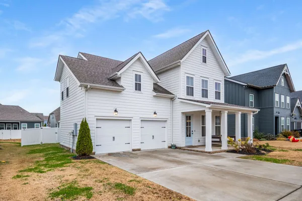 front view of a house with a yard