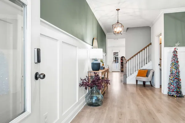 a view of an entryway with wooden floor