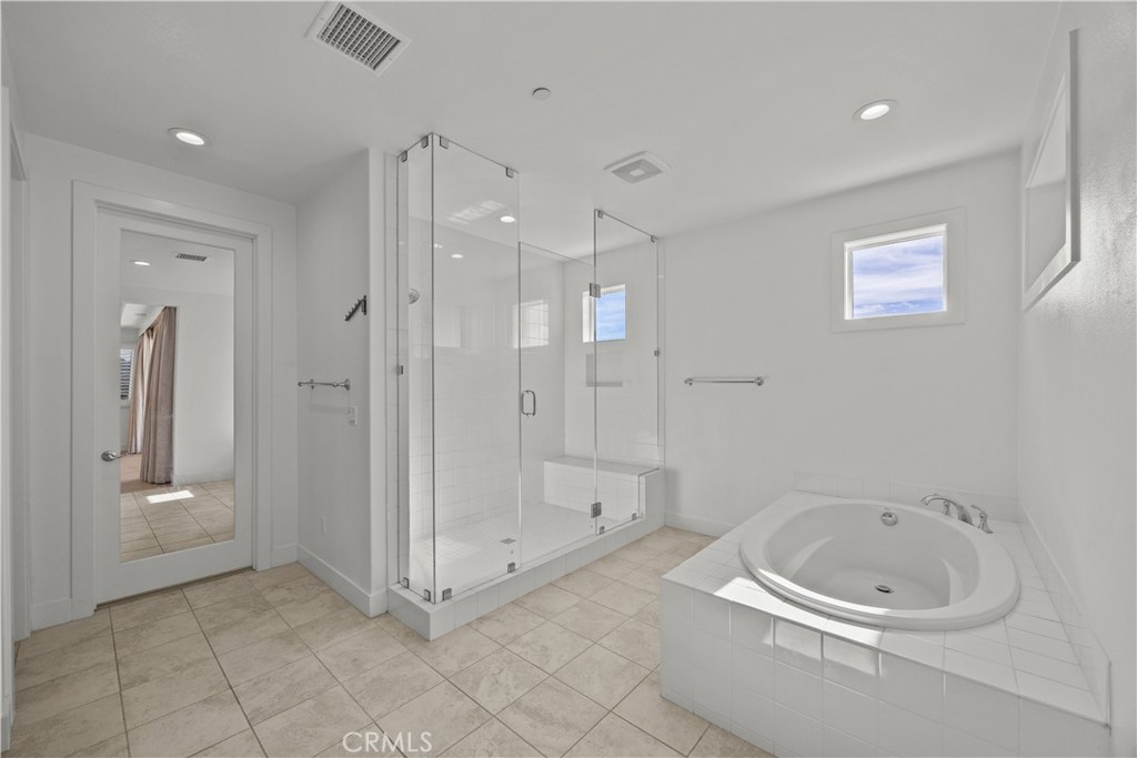 20638 Deer Grass Court Porter Ranch, CA 91326 - Photo 30 of 50 a bathroom with a tub a sink and a shower