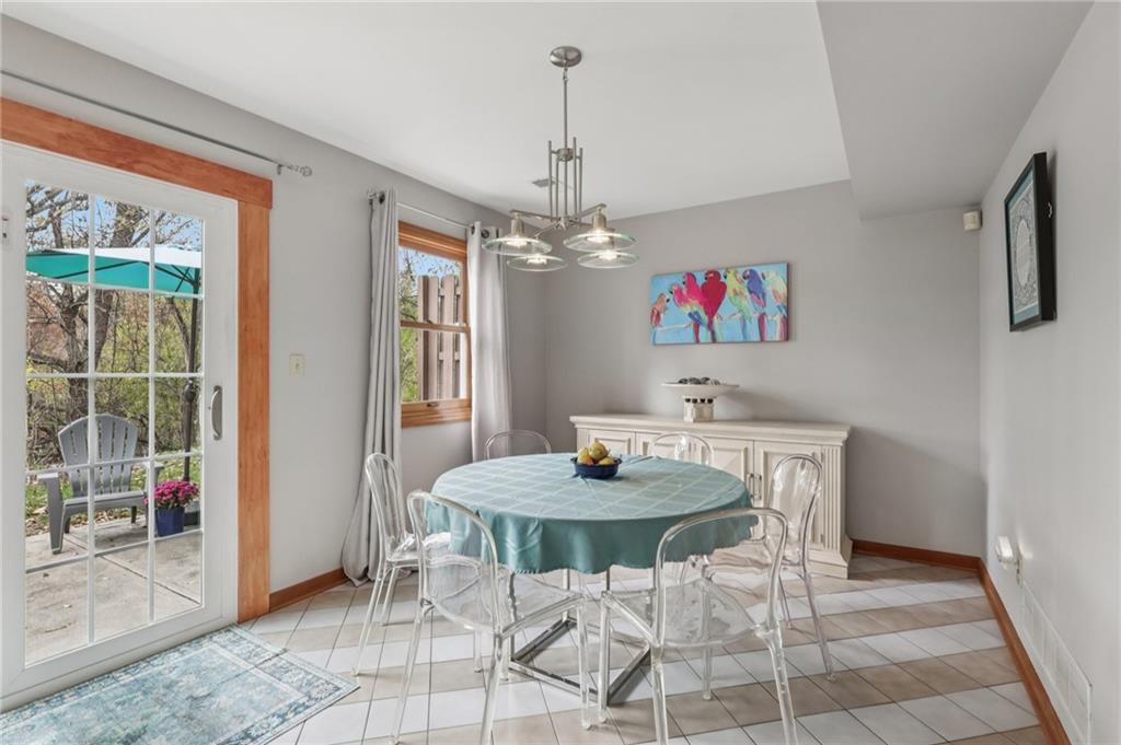 416 Chandler Place Pittsburgh, PA 15212 - Photo 12 of 38 a view of a dining room with furniture wooden floor and a chandelier