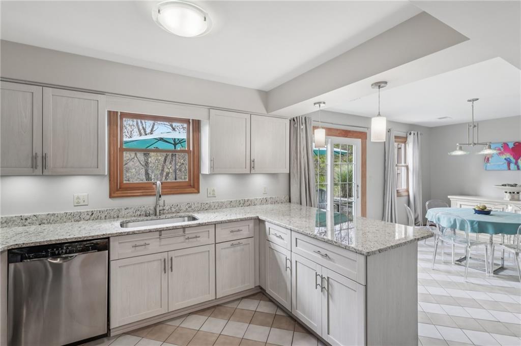 416 Chandler Place Pittsburgh, PA 15212 - Photo 18 of 38 a kitchen with a sink stove and cabinets