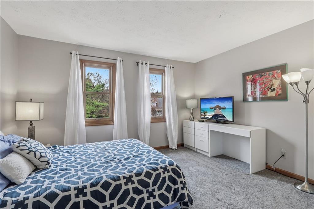 416 Chandler Place Pittsburgh, PA 15212 - Photo 24 of 38 a bedroom with a bed and a flat screen tv