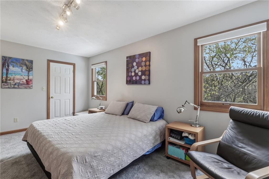 416 Chandler Place Pittsburgh, PA 15212 - Photo 30 of 38 a bedroom with a bed and wooden floor