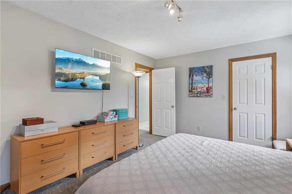 416 Chandler Place Pittsburgh, PA 15212 - Photo 31 of 38 a bedroom with a bed and cabinet