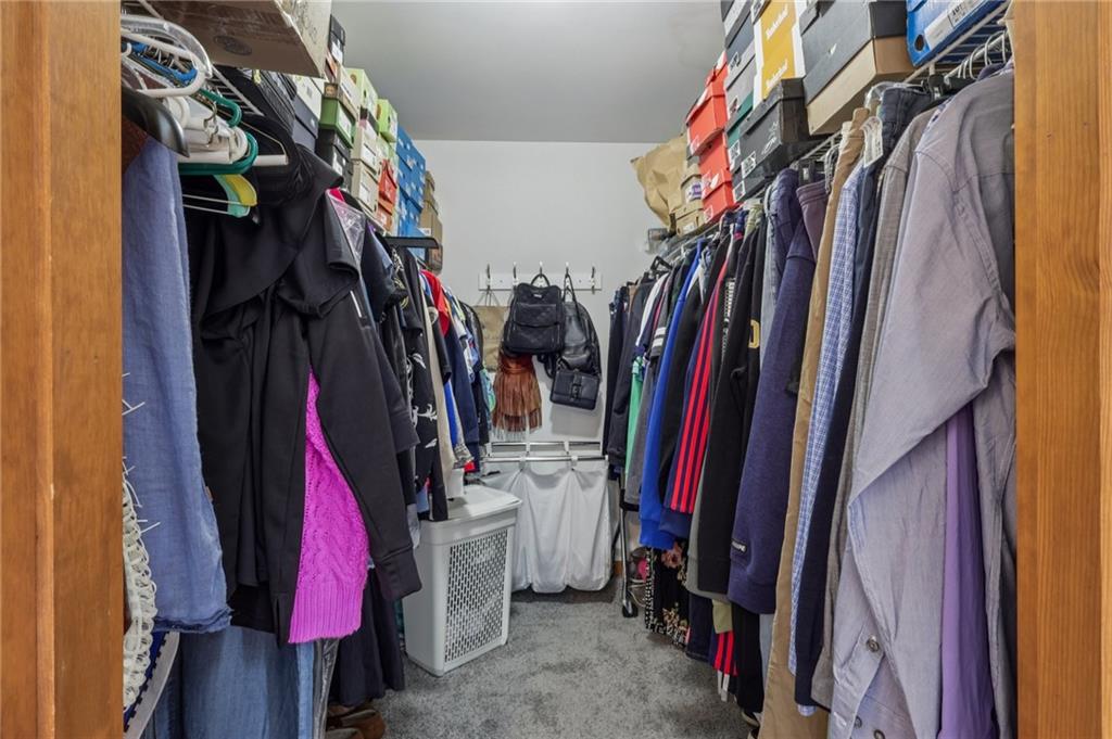 416 Chandler Place Pittsburgh, PA 15212 - Photo 32 of 38 a view of walk in closet with clothes