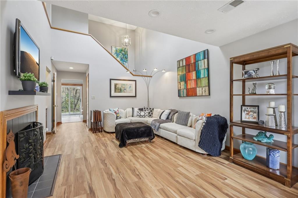 416 Chandler Place Pittsburgh, PA 15212 - Photo 5 of 38 a living room with furniture a flat screen tv and a fireplace