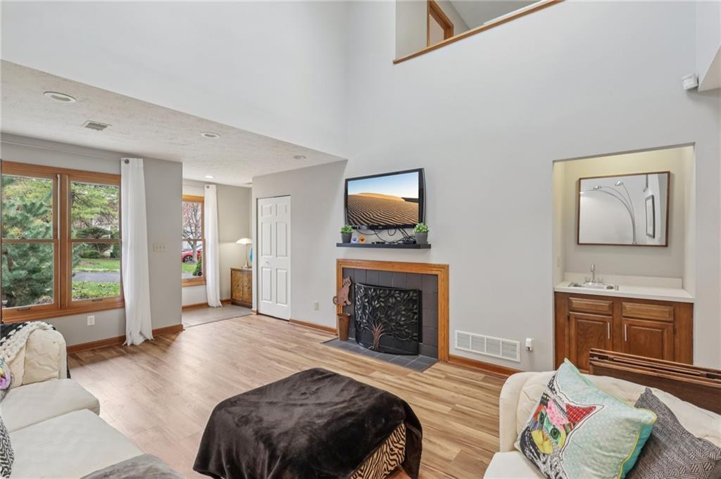 416 Chandler Place Pittsburgh, PA 15212 - Photo 8 of 38 a bedroom with a bed and a fireplace