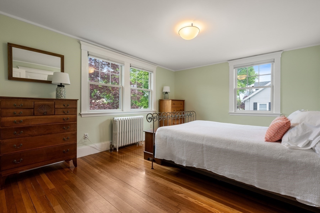 8 Charlotte Road Marblehead, MA 01945 - Photo 20 of 37 a bedroom with a bed and a large window