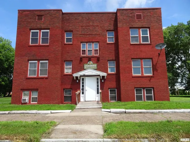 a brick building view that has a lots of windows in it