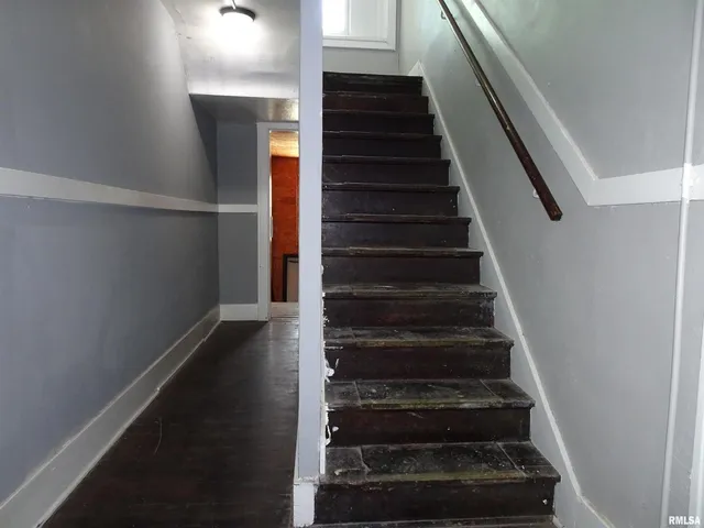 a view of a storage and utility room with rack and racks on the wall