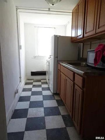 a bathroom with a sink toilet and bathtub