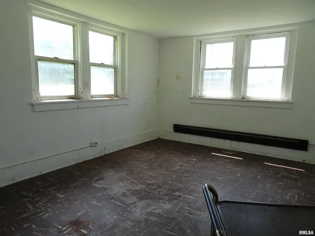 a view of a brick building next to a yard