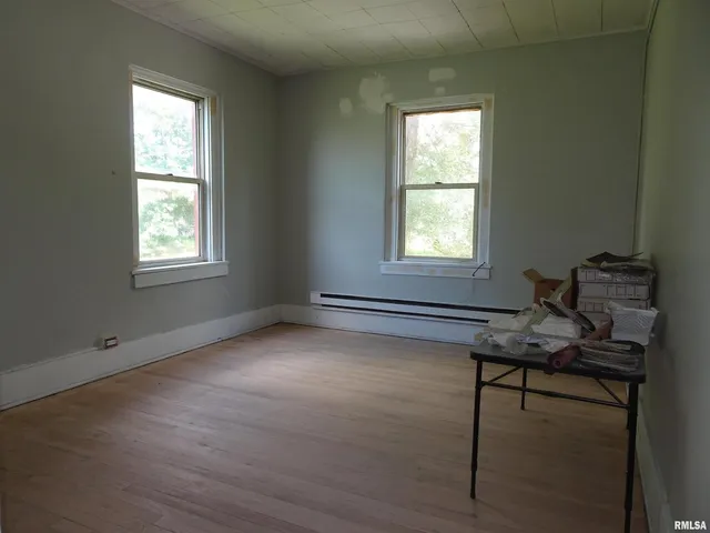 a bathroom with a bathtub and a window