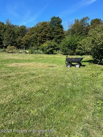 a view of swimming pool with a yard