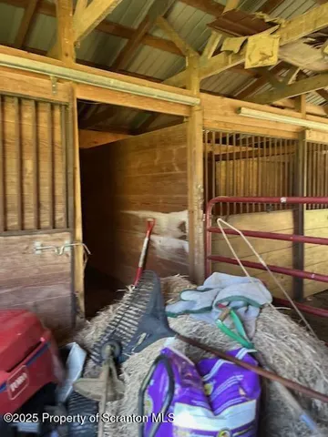a view of a backyard with wooden fence