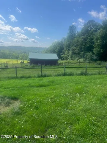 a view of outdoor space and yard