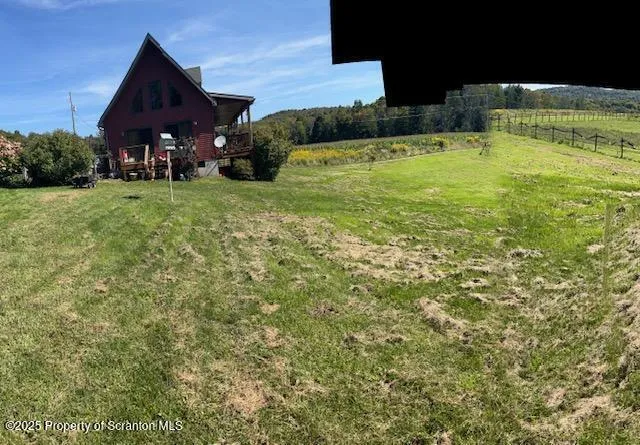 a view of a lake with a big yard