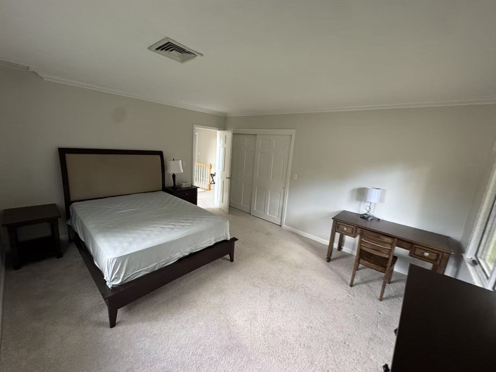 22 Capt Samuel Forbush Road Westborough, MA 01581 - Photo 19 of 38 a bedroom with a bed and a lamp on desk