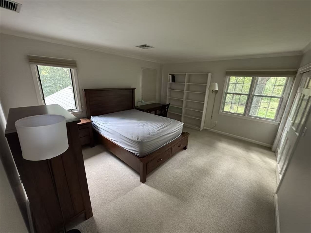 22 Capt Samuel Forbush Road Westborough, MA 01581 - Photo 20 of 38 a bedroom with a bed chair and a window