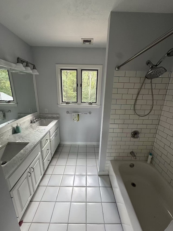 22 Capt Samuel Forbush Road Westborough, MA 01581 - Photo 22 of 38 a bathroom with a sink a toilet a mirror and bathtub
