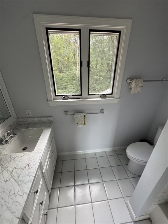 22 Capt Samuel Forbush Road Westborough, MA 01581 - Photo 23 of 38 a bathroom with a sink a toilet and window