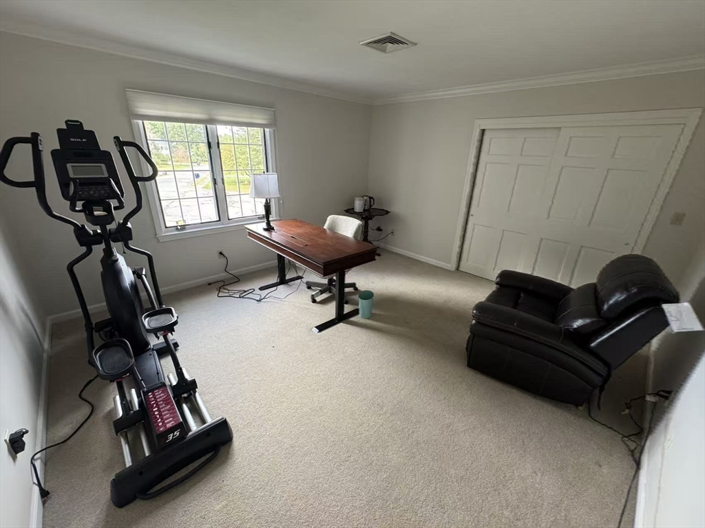 22 Capt Samuel Forbush Road Westborough, MA 01581 - Photo 24 of 38 a living room with furniture gym equipment and a window