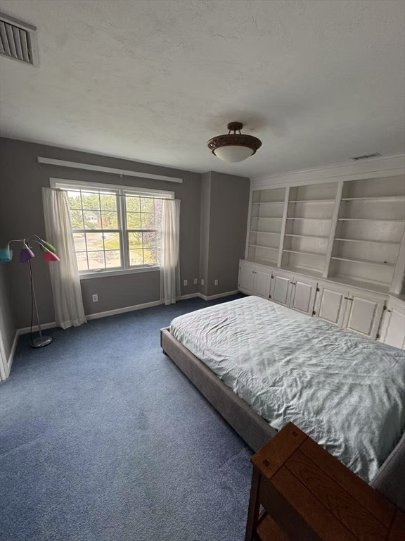 22 Capt Samuel Forbush Road Westborough, MA 01581 - Photo 26 of 38 a bed sitting in a bedroom next to a window