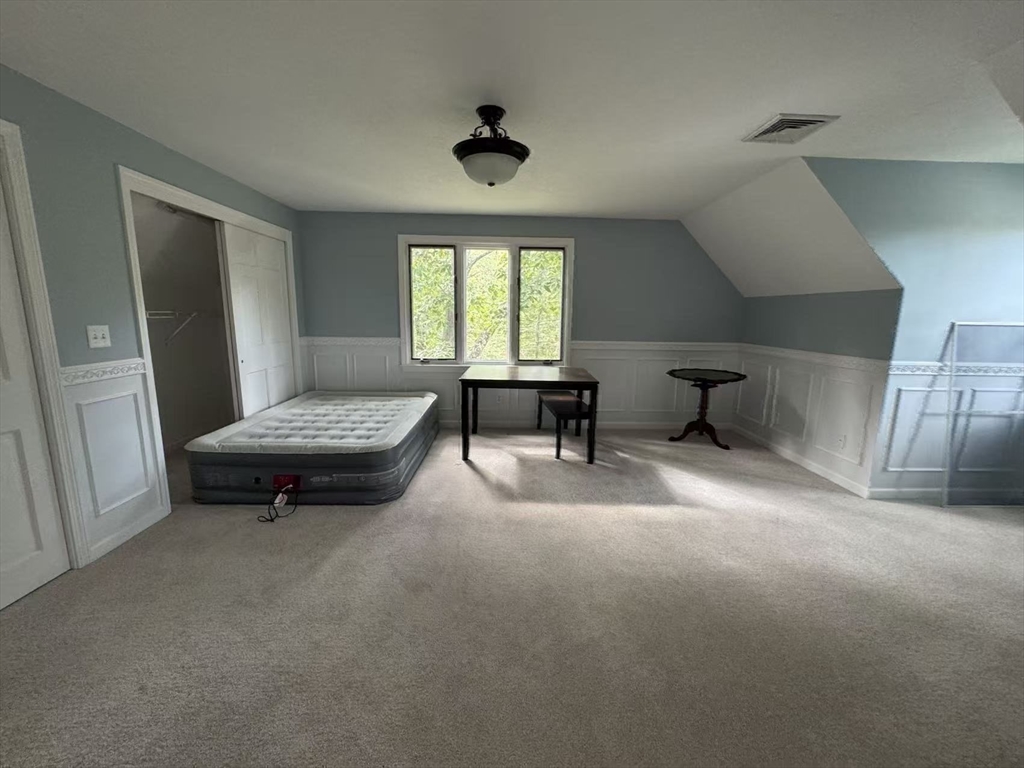 22 Capt Samuel Forbush Road Westborough, MA 01581 - Photo 30 of 38 a living room with furniture and a chandelier