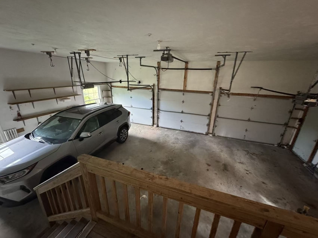 22 Capt Samuel Forbush Road Westborough, MA 01581 - Photo 36 of 38 a car parked in a garage