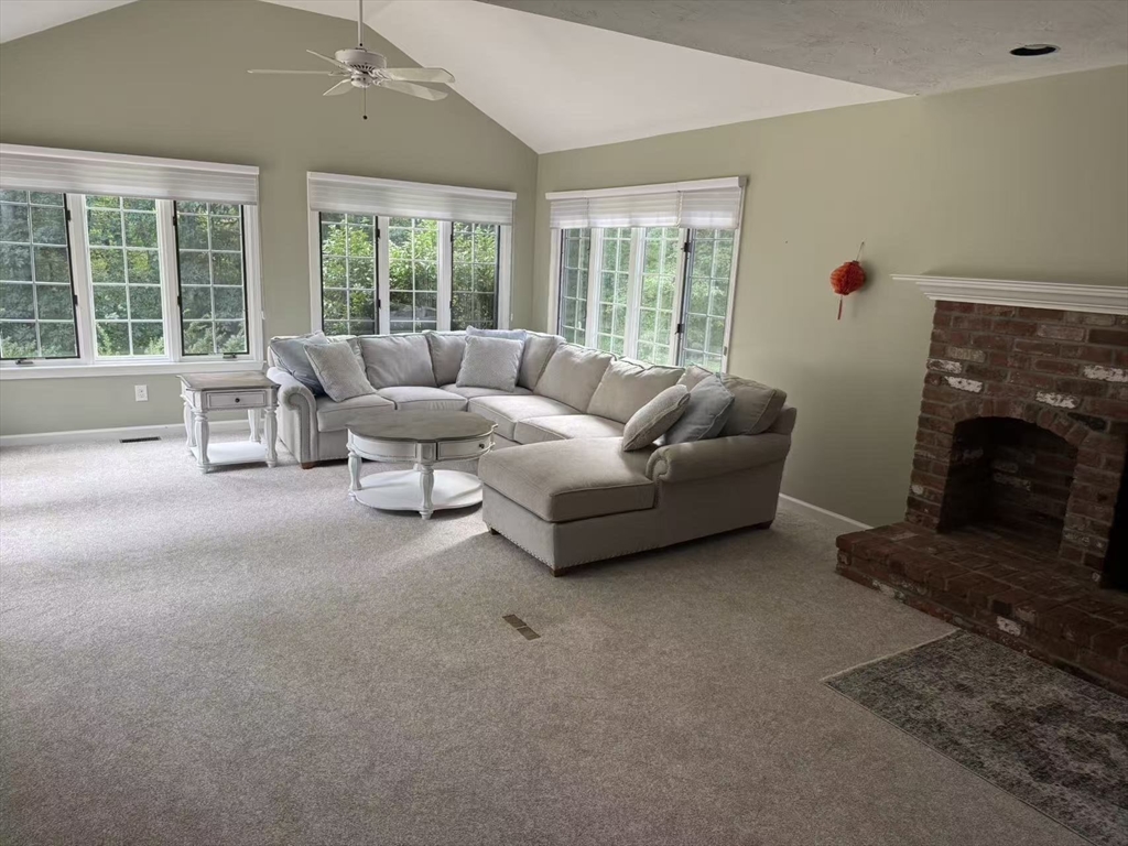 22 Capt Samuel Forbush Road Westborough, MA 01581 - Photo 8 of 38 a living room with furniture and a fireplace
