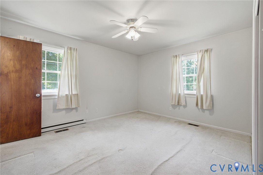 10215 River Road Petersburg, VA 23803 - Photo 21 of 31 Carpeted flooring, white walls, two windows with w