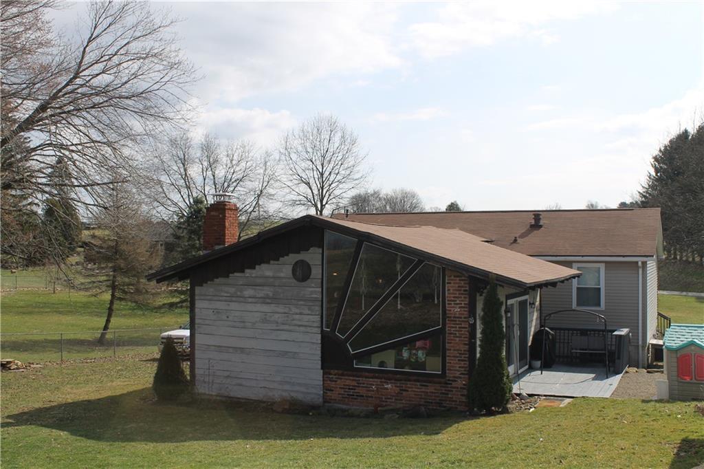 719 Freeport Road Freeport, PA 16229 - Photo 4 of 25 a view of a house with backyard and sitting area