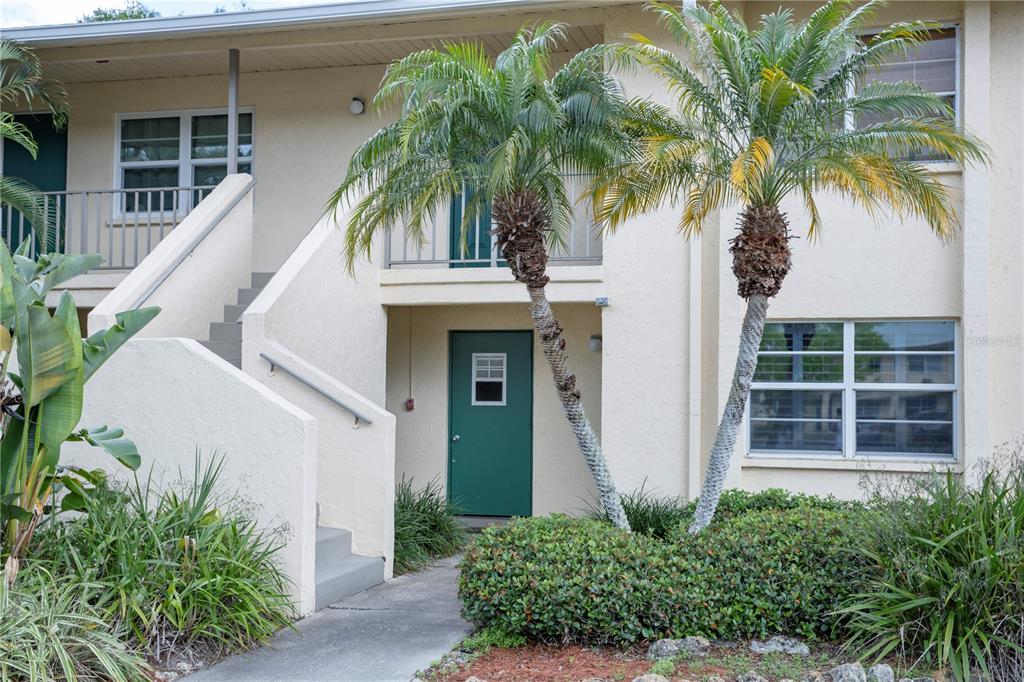 4805 Rilma Avenue, Unit 106 Sarasota, FL 34234 - Photo 1 of 24 a view of house with palm trees