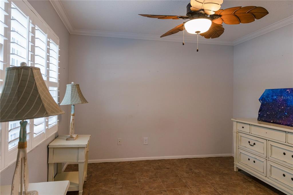 4805 Rilma Avenue, Unit 106 Sarasota, FL 34234 - Photo 11 of 24 a view of cabinets and wooden floor