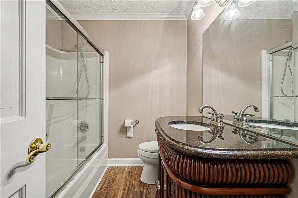 740 Smyrna Road Southwest Conyers, GA 30094 - Photo 19 of 27 a bathroom with a sink and a mirror